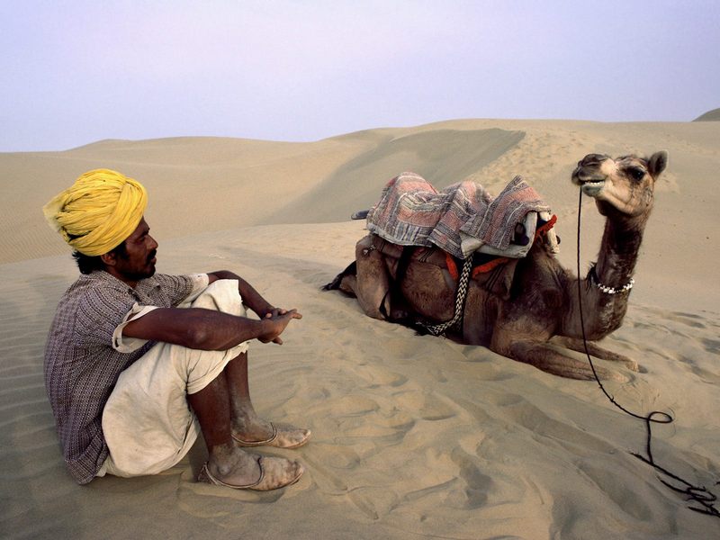 Taking a Break in the Sam Sand Dunes, India; DISPLAY FULL IMAGE.