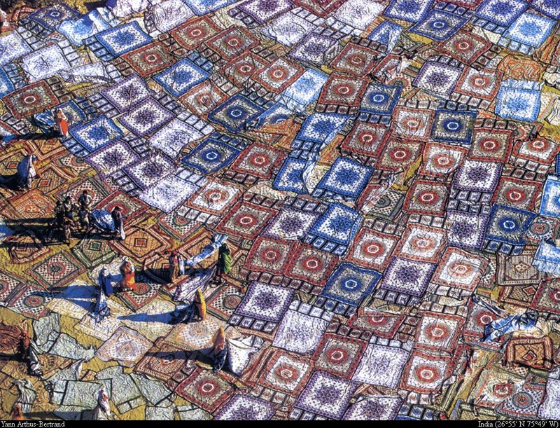 [B14 SLR: Yann Arthus-Bertrand] Cotton fabrics drying in the sun in Jaipur; DISPLAY FULL IMAGE.